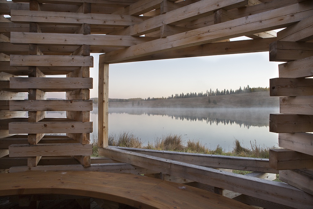 From the interior of Young Project's Fire Place, an opening in the structure provides a view back to the landscape of Carraig Ridge